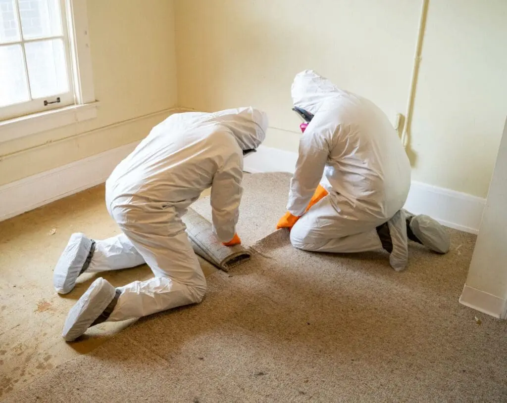 Hazmat workers removing hazardous materials