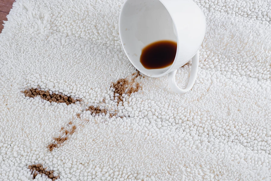 coffee spilled on white carpet