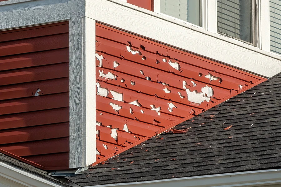 siding on a house damaged from hail storm